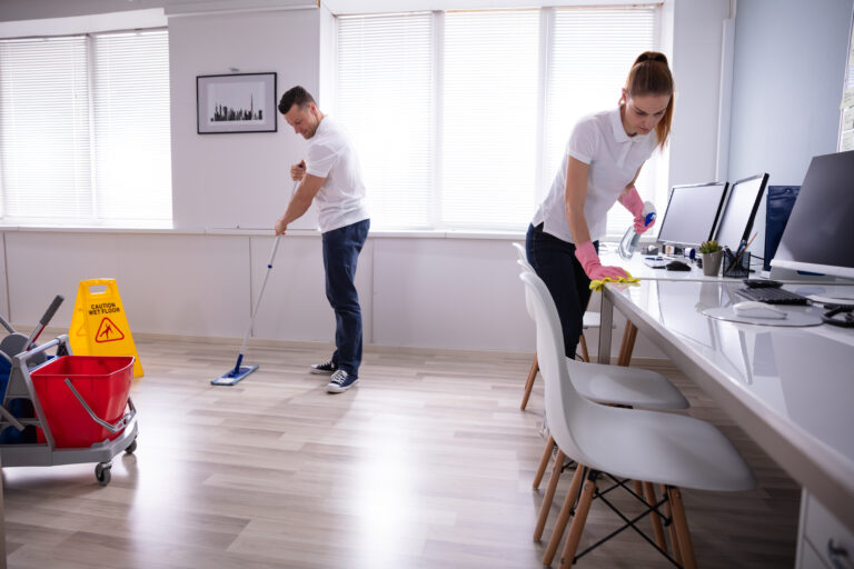 Two Janitors Cleaning an Office